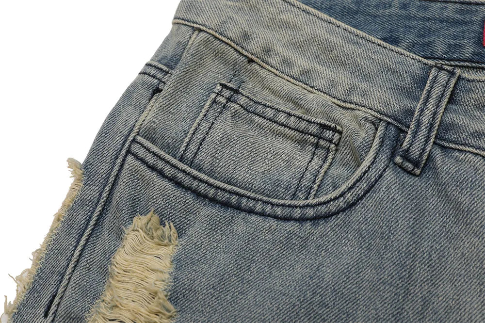 Stained Ripped Flared Jeans