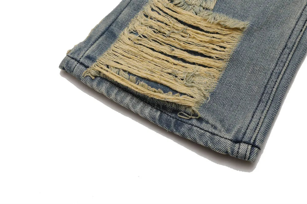 Stained Ripped Flared Jeans