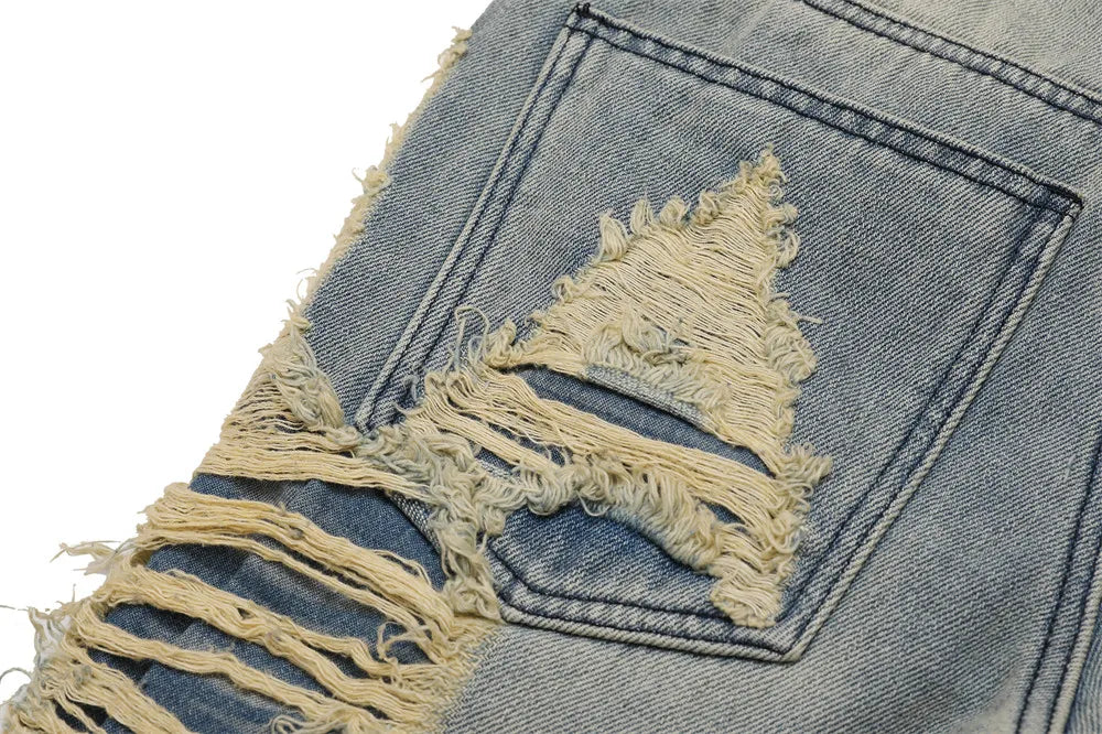 Stained Ripped Flared Jeans